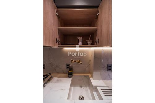 a bathroom with a sink in a room at Condomínio Residencial Unique Residence - São José do Rio Preto in Sao Jose do Rio Preto