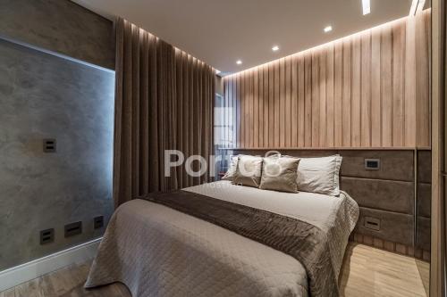 a bedroom with a bed and a large window at Condomínio Residencial Unique Residence - São José do Rio Preto in Sao Jose do Rio Preto