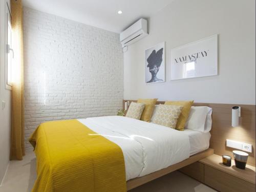 Tempat tidur dalam kamar di Sunny Playa Apartment