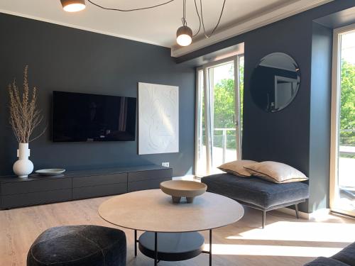 TV a/nebo společenská místnost v ubytování FeWo Prora - Designapartment Sir Henry