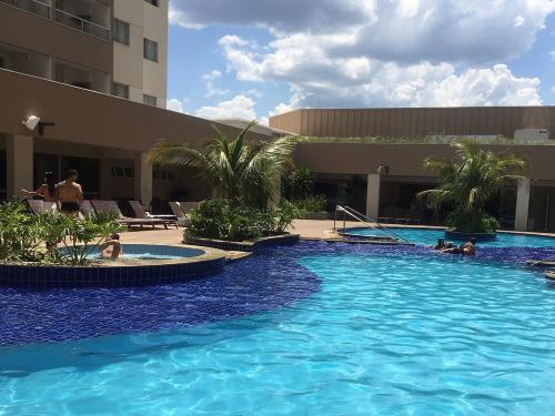 a large swimming pool in front of a building at OLÍMPIA PARK RESORT O MAIS DIVERTIDO RESORT EM FRENTE AO THERMAS DOS LARANJAIS - PAGUE em ATÉ 12 VEZES in Olímpia