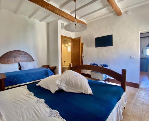 Ένα ή περισσότερα κρεβάτια σε δωμάτιο στο Panoramic Nest In Montalcino