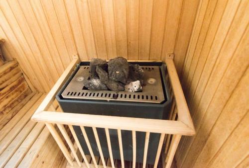a sauna with a box of rocks in it at Studio en Palermo Soho in Buenos Aires