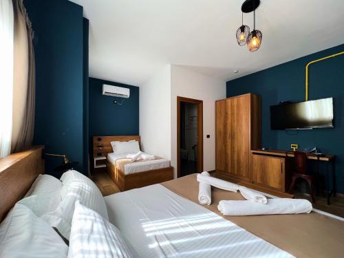 Postel nebo postele na pokoji v ubytování Oda Hotel Tirana