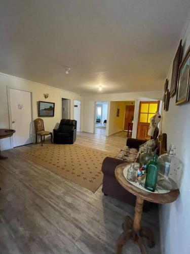 a living room with a couch and a table at Hostal Nomade in Constitución