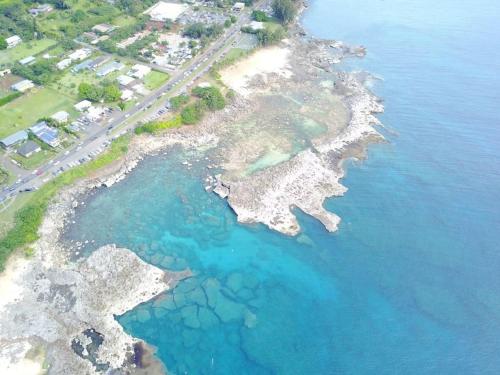 an aerial view of an island in the water at Waimea Bay Luxury Estate Views & Hot Tub in Haleiwa