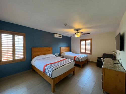 Postel nebo postele na pokoji v ubytování Hotel Quinta