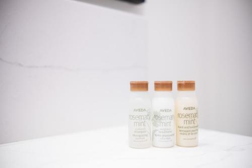 three bottles of essential oils sitting on a table at Ravencrest by Outpost Whistler in Whistler