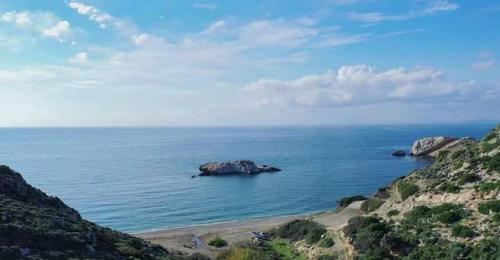 a large rock in the middle of the ocean at ‘Sophie’s Villa’ in Naxos Chora