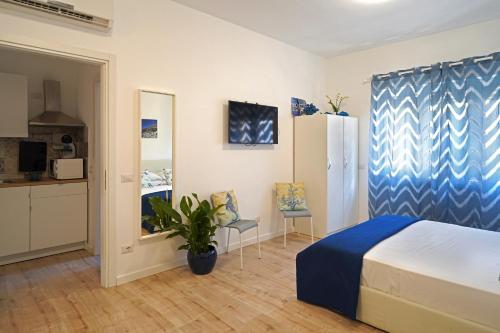 Posteľ alebo postele v izbe v ubytovaní Piazza Lauro Suites