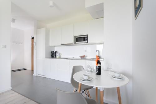 Η κουζίνα ή μικρή κουζίνα στο Symphony Modern Tower Apartamenty