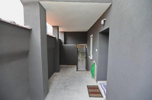 a hallway of a house with a staircase in it at iLposto Down in Kavala