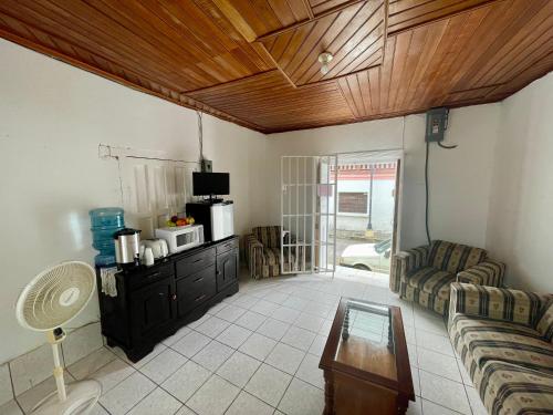 a living room with a couch and a table at Hostal Inn 1 in Flores