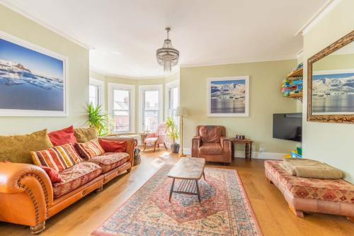a living room with a couch and a table at Host & Stay - Cabbell Towers in Cromer