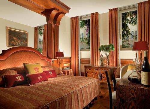 Postel nebo postele na pokoji v ubytování Bio Hotel Raphael - Relais & Châteaux