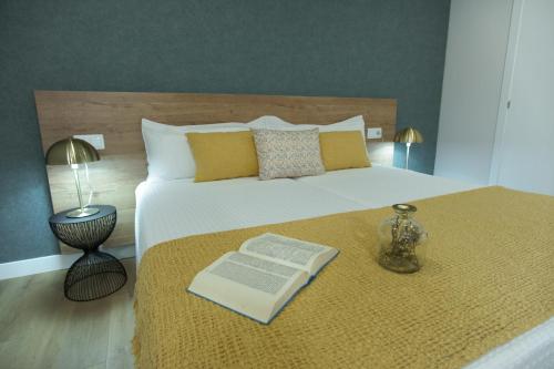 Ένα ή περισσότερα κρεβάτια σε δωμάτιο στο A Casa de Lena - Apartamentos Turísticos