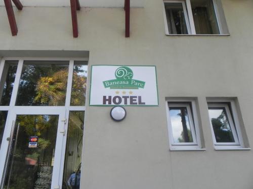 a hotel sign on the side of a building at Hotel Baneasa Parc in Bucharest