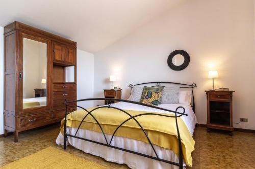Villa Donatelli tesisinde bir odada yatak veya yataklar