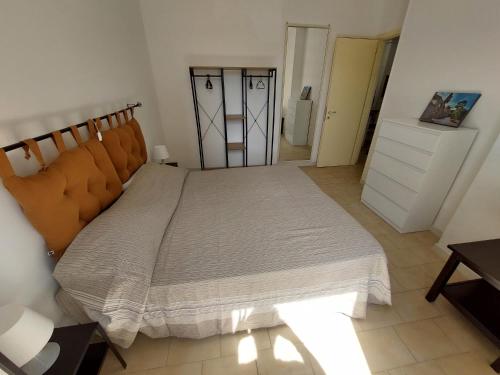 Ένα ή περισσότερα κρεβάτια σε δωμάτιο στο Appartamento Porta Marina