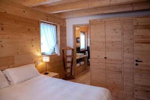 Ένα ή περισσότερα κρεβάτια σε δωμάτιο στο Chalet del Capriolo