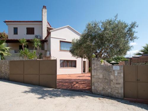 a house with a fence in front of it at Villa Metapothia Gavalochori Crete in Gavalochori