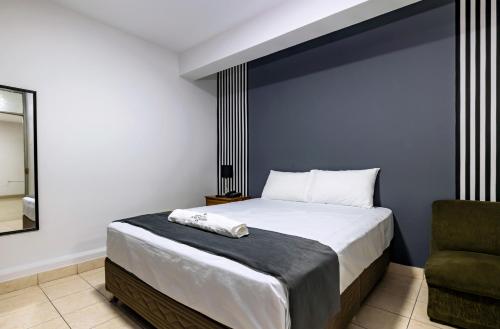 Hotel Taurus tesisinde bir odada yatak veya yataklar