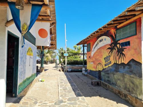 a building with a mural on the side of it at SUITE CON TERRAZA PANORAMICA in Puebloviejo