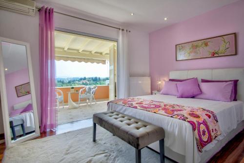 Ένα ή περισσότερα κρεβάτια σε δωμάτιο στο Seaview Villa & Suites
