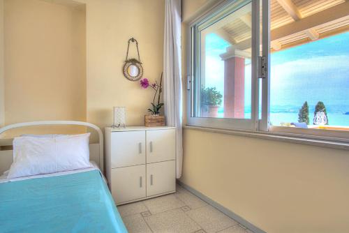 Ένα ή περισσότερα κρεβάτια σε δωμάτιο στο Seaview Villa & Suites
