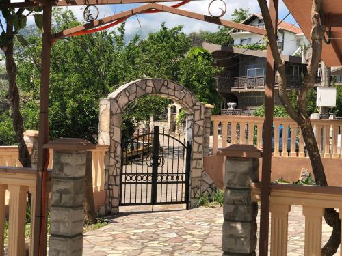an entrance to a house with an iron gate at Апартаменты Jasmine in Bar