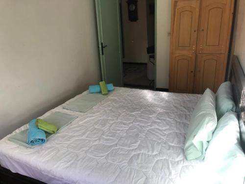 a large white bed in a room with a mirror at Dar el Koutoubia in Marrakech