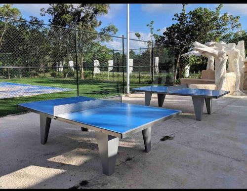two blue ping pong tables in a park at Espectacular Apartamento En Tanama Cap Cana in Punta Cana