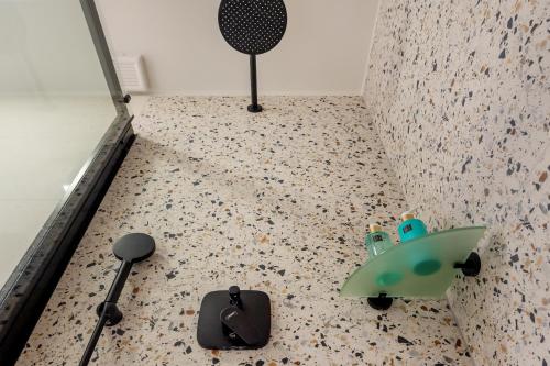 a room with a table with a toy on the floor at Old Spalatrum Luxury Rooms in Split