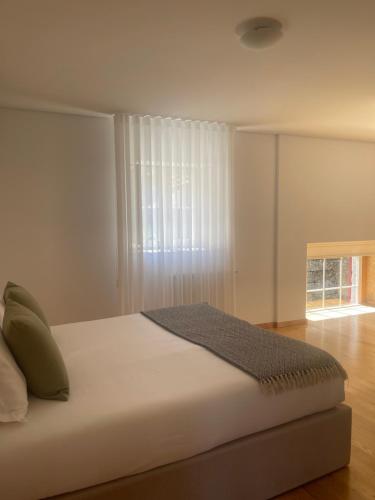 Кровать или кровати в номере Casa do Afonso