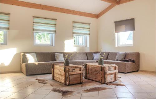 a living room with a couch and two wooden crates at Vakantiewoning 4 in Simpelveld