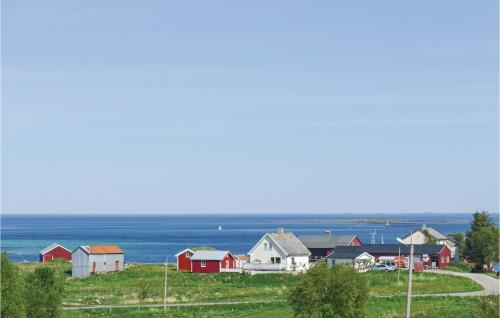 a group of houses on a hill next to the ocean at Beautiful Home In Vega With Wifi in Holand