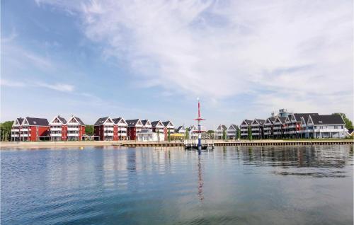 a group of houses on the shore of a body of water at 1 Bedroom Gorgeous Apartment In Rechlin in Rechlin