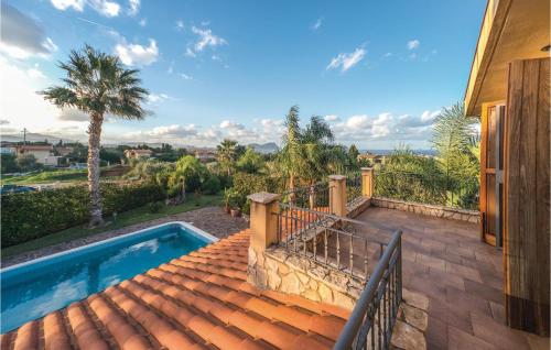a house with a swimming pool on a roof at Villa Tourig Beach in Mandra Capreria