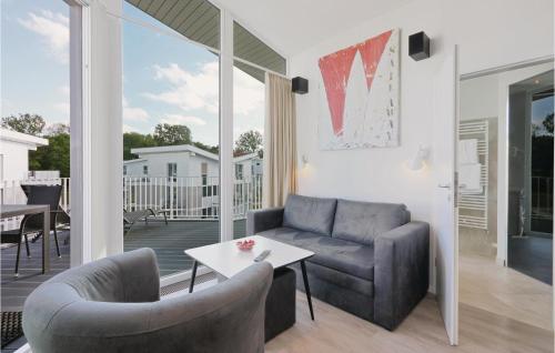 a living room with a couch and a table at Dünenvilla 14, Whg 9 in Priwall