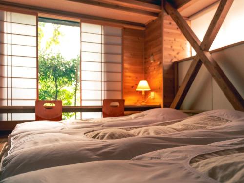 En eller flere senger på et rom på Yamaen Enso / Vacation STAY 32534