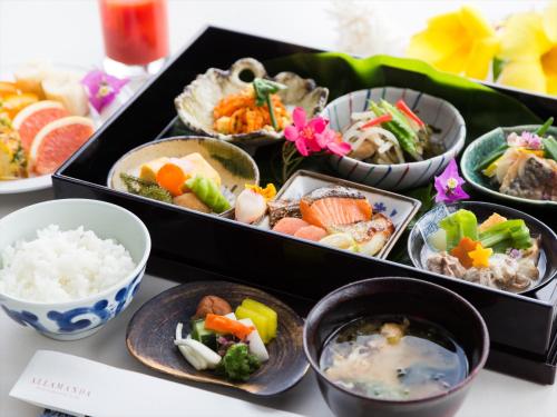 a tray of different types of food on a table at Shigira Bayside Suite Allamanda in Miyako Island