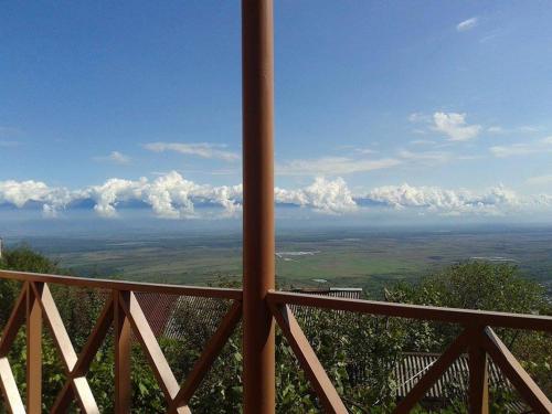 a view of the plains from a balcony of a building at Guest House Kusika in Sighnaghi