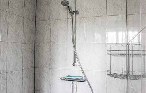 a shower with a shower head in a bathroom at Awesome Home In Acquoy With Wifi in Acquoy