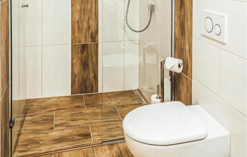 a bathroom with a toilet and a shower at Schoenes Ferienhaus Zillertal in Hart im Zillertal