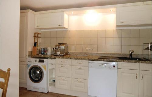 a kitchen with a washing machine and a washer at Gorgeous Home In Vianden With Wifi in Vianden