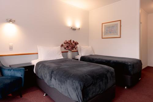 Postel nebo postele na pokoji v ubytování Aotearoa Lodge