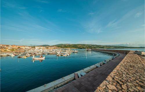 a group of boats are docked in a harbor at Trilo Sup in Isola Rossa