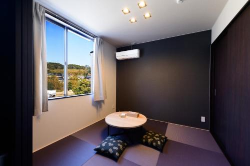 a small bathroom with a table and a window at Rakuten STAY HOUSE x WILL STYLE Sasebo 104 in Sasebo