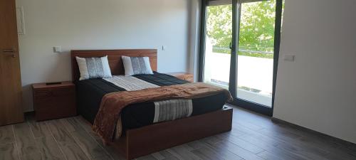 Кровать или кровати в номере Casa Gidelos