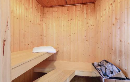 a sauna with a wooden paneled wall at Meeresrauschen 2 - Dorf 6 in Priwall